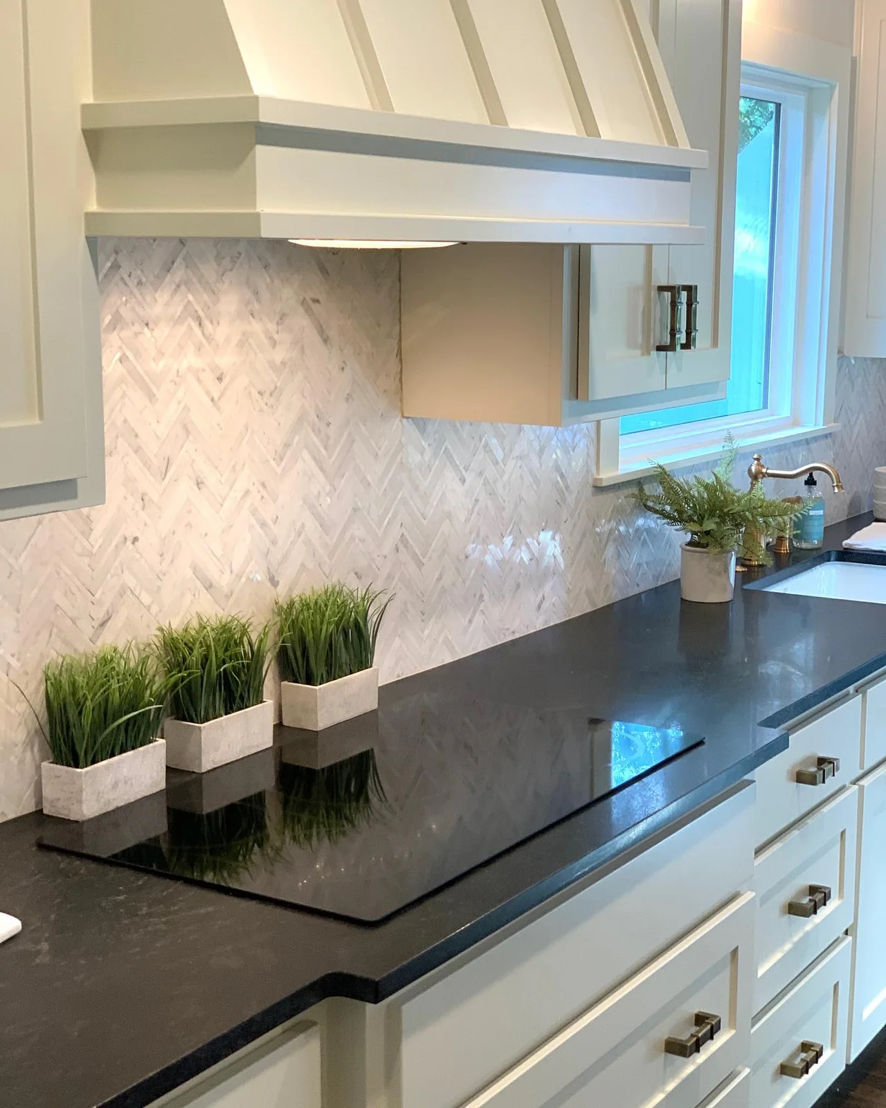 Black Mist honed countertop in a bright kitchen